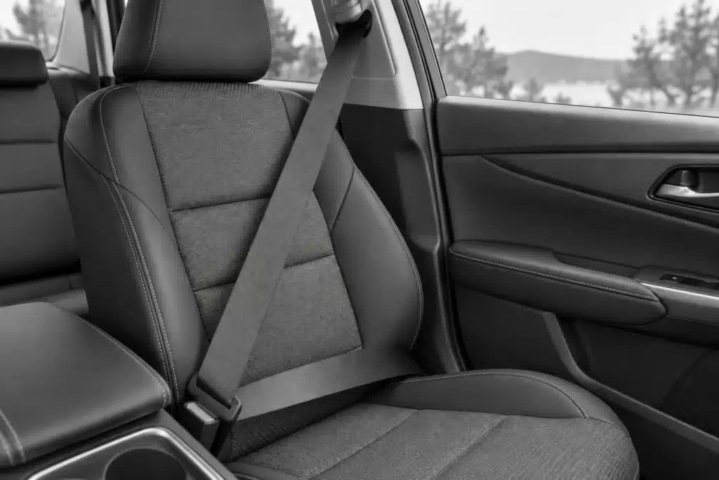 Fastened three-point seat belt across an unoccupied vehicle seat.