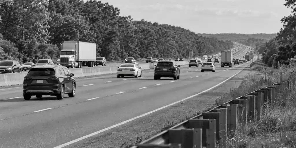 Cars and trucks traveling on a divided highway