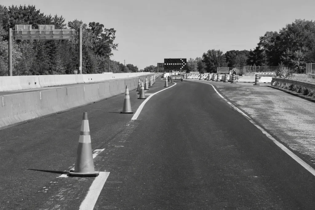 Cones marking a temporary lane shift in a highway work zone