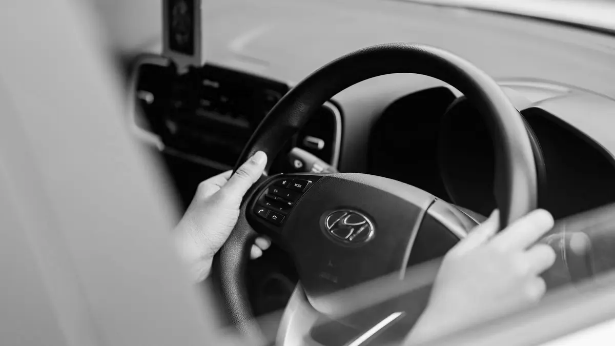 Grayscale stock photograph illustrating sue uber lyft