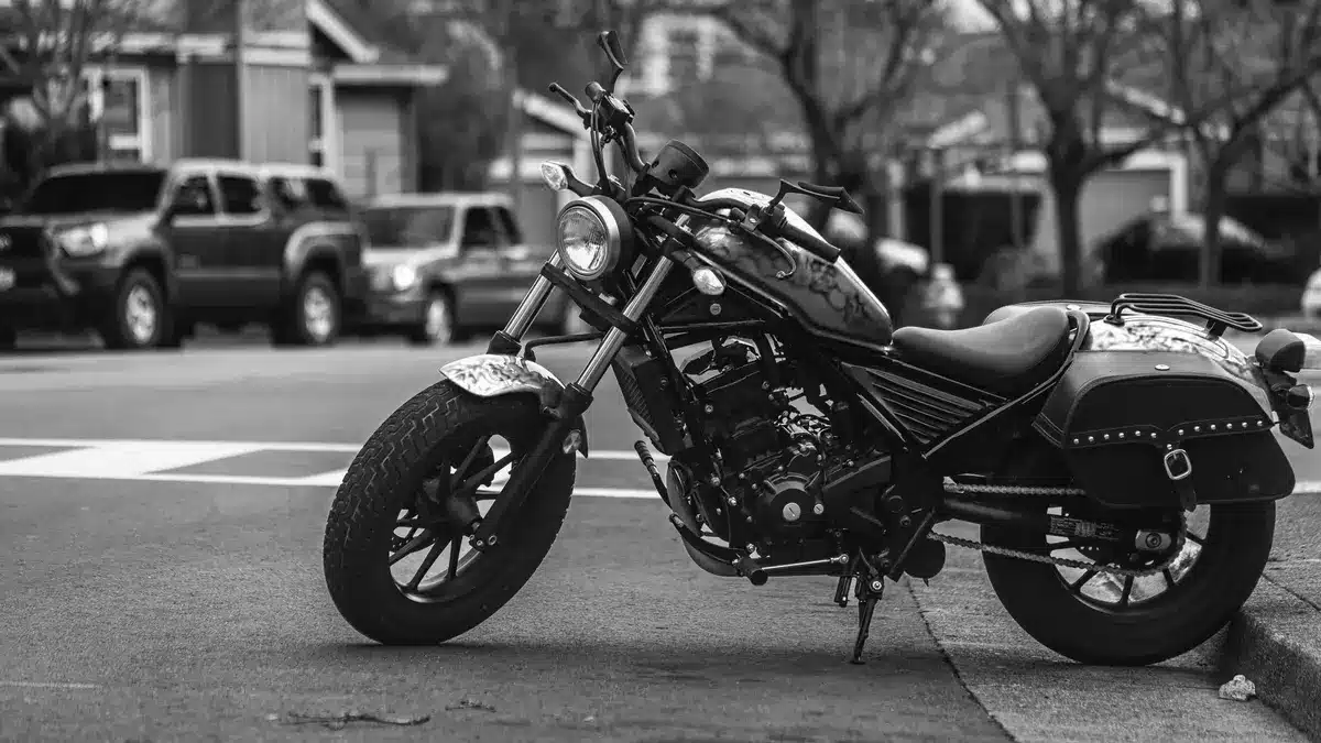 Grayscale stock photograph illustrating motorcyclists preserve early fall